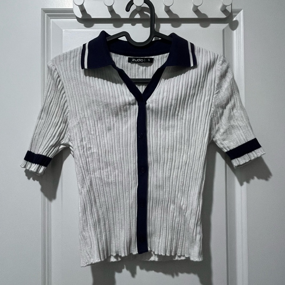 White and navy top